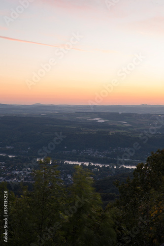Skyline over the Rhine into a German low mountain range at sunset