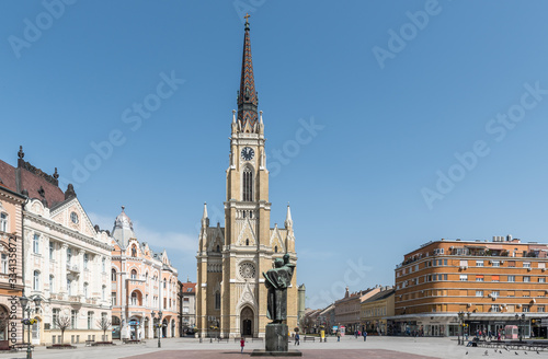 Novi Sad  Serbia city center with cathedral and old buildings with small group of people almost empty during the coronavirus or covid-19 isolation