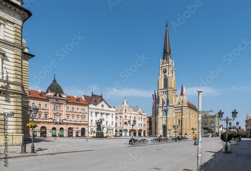 Novi Sad, Serbia city center with cathedral and old buildings with small group of people almost empty during the coronavirus or covid-19 isolation.