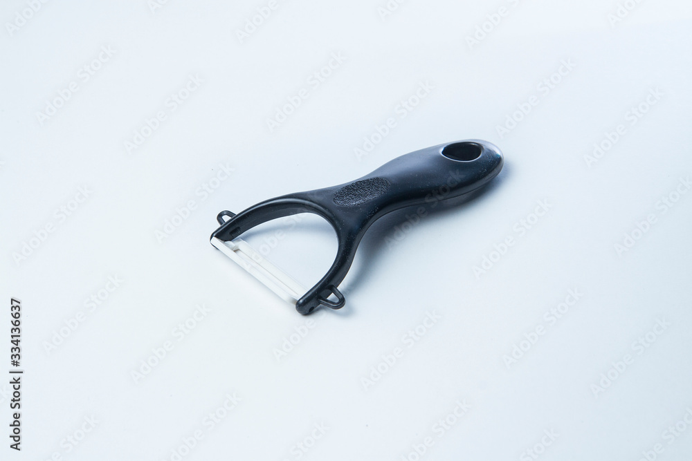 vegetable and fruit peeler isolated on white background vegetable and fruit peeler isolated on white background