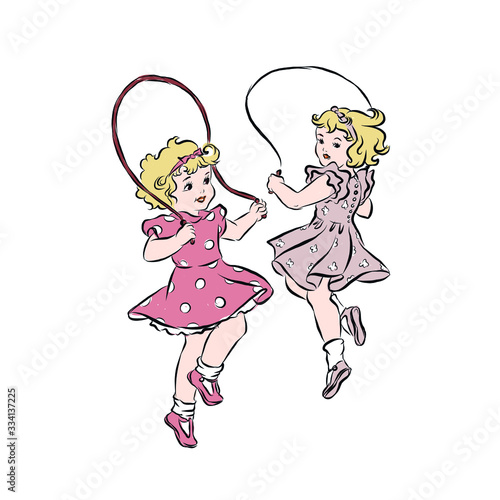 Two girlfriends jump on skipping rope. Blonde girls dressed in pink dresses. Children's games in the open air. Exercise using inventory. 