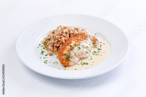 cutlet with buckwheat on the white background