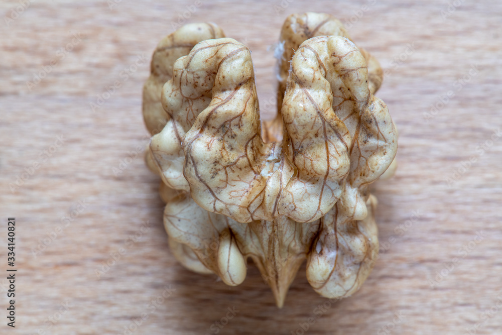 Walnut kernel on a wooden background	