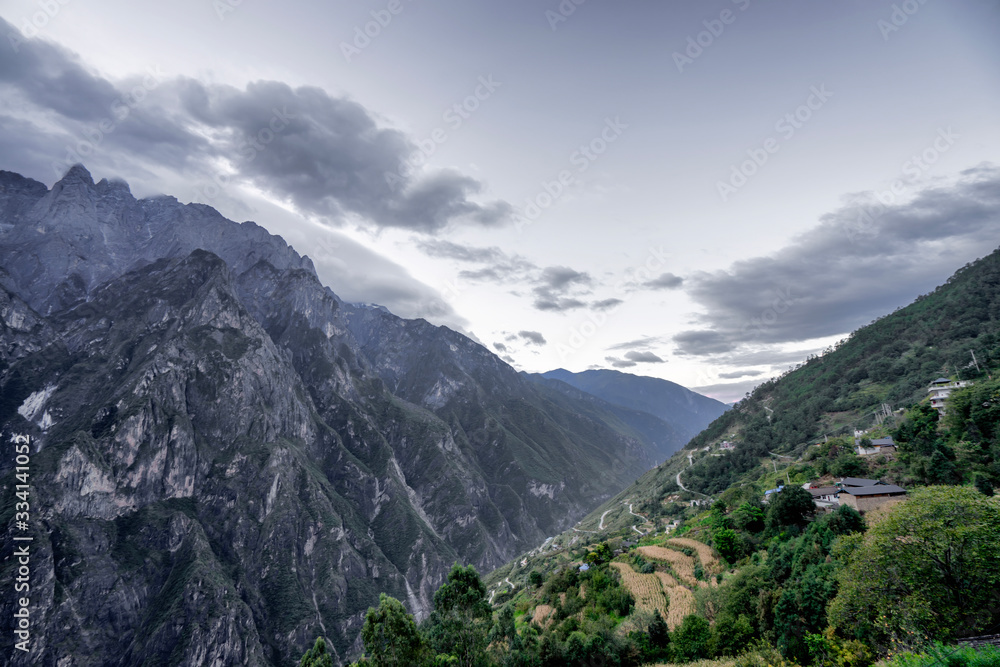 Panoramic top view of the Jade Dragon Snow Mountain on the hiking trails of the Tiger Leaping Gorge, Lijiang Yunnan, China