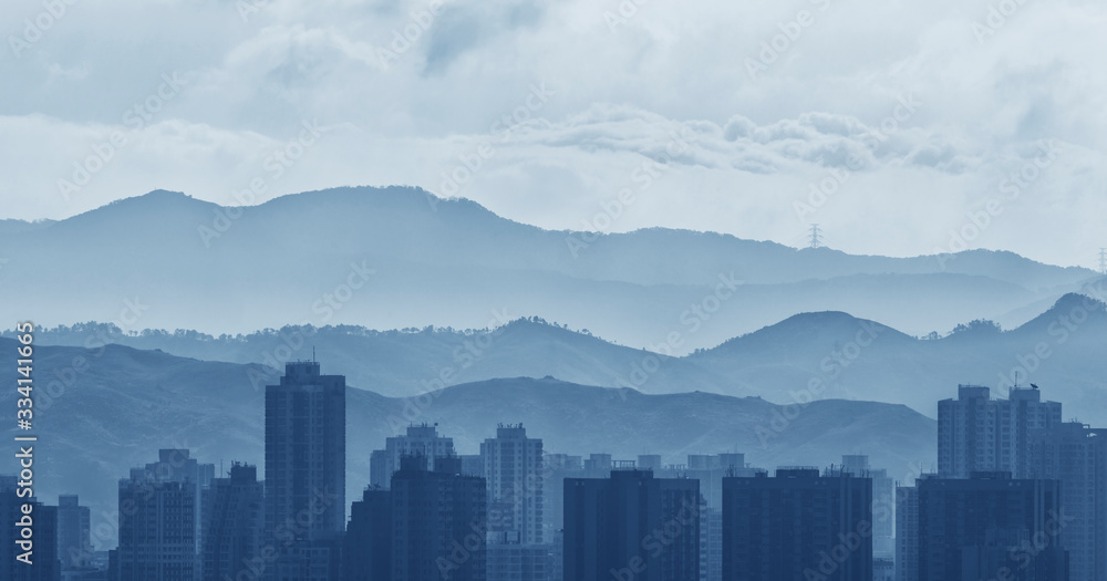 City skyline and mountain landscape of Hong Kong at dawn