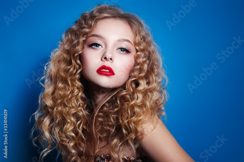 Wallpaper Mural Beauty woman with curly hair afro hairstyle and red lips on classic blue background Torontodigital.ca
