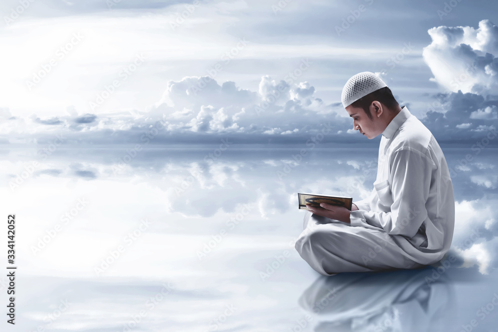 Religious muslim man reading holy quran Religious muslim man reading holy quran