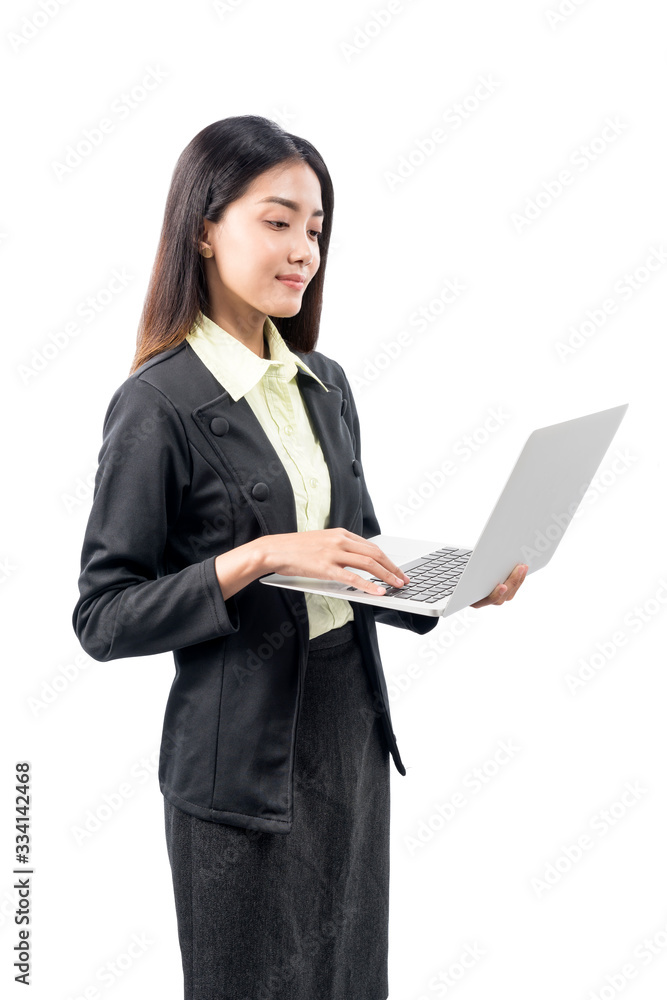 Asian businesswoman standing while using laptop Asian businesswoman standing while using laptop