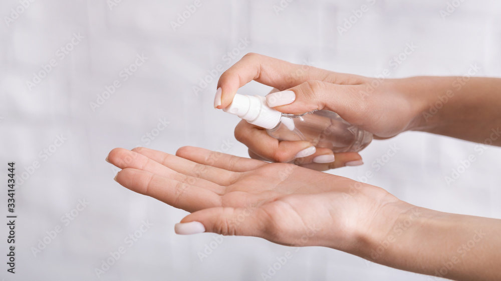 Protection from coronavirus. Woman sprays antiseptics on her hands. Protection from coronavirus. Woman sprays antiseptics on her hands.
