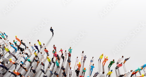 Businessman leader leading a large group of people.
