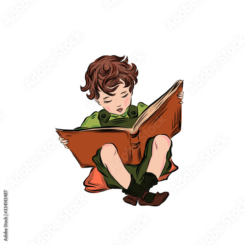 Little boy reading a book. Clever kid. 