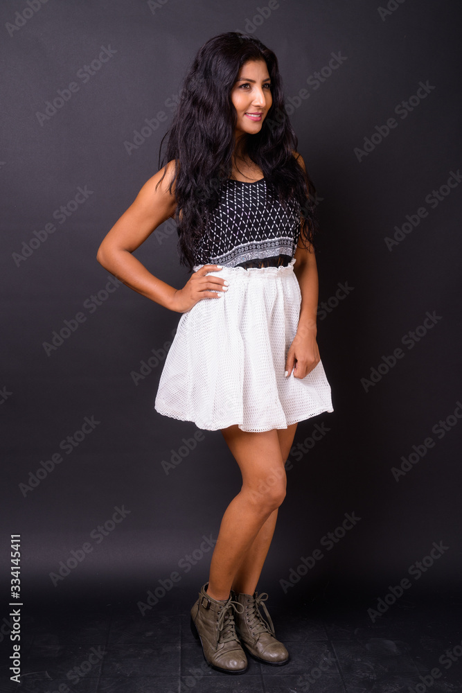 Full body shot of happy young beautiful Indian woman Full body shot of happy young beautiful Indian woman