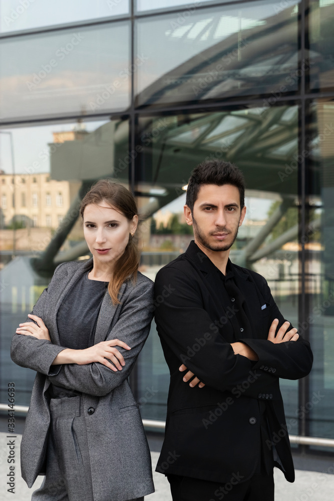 Business partners on the background of an office building. Business partners on the background of an office building.