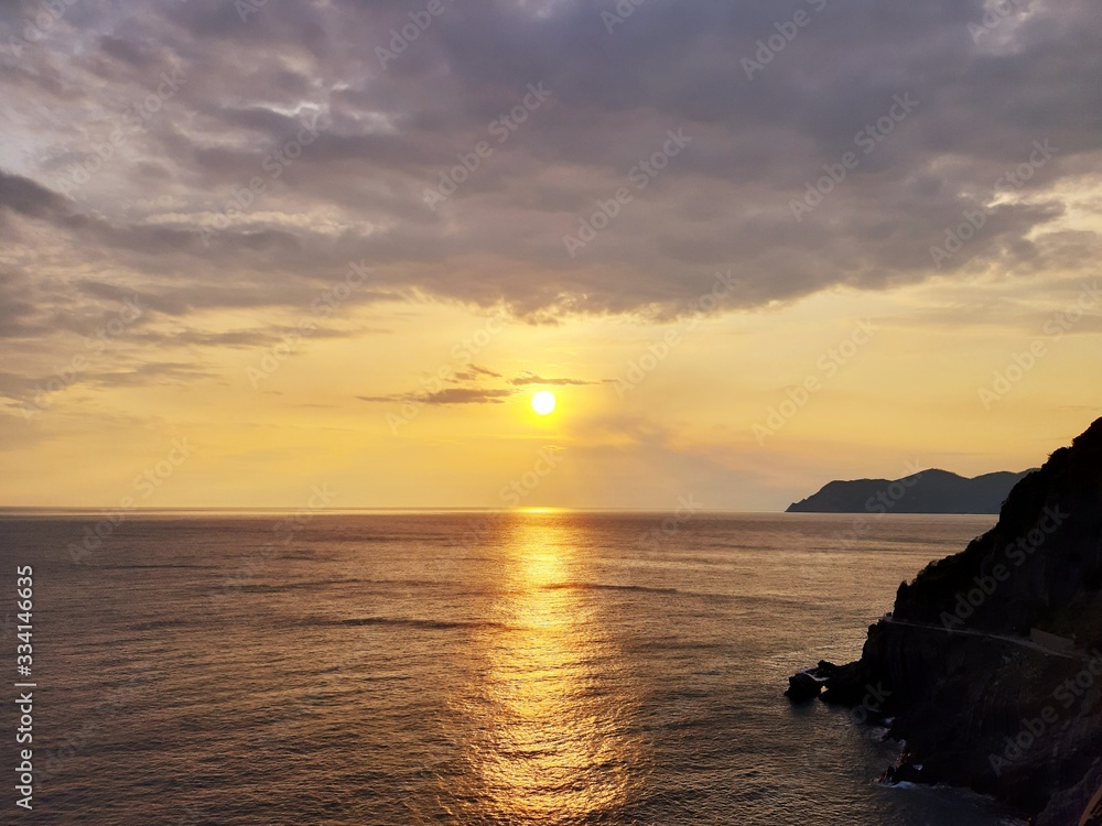 An amazing caption of the sunset from Monteroso, Cinque Terre, in summer days over the sea with beautiful coloured sky in the background.