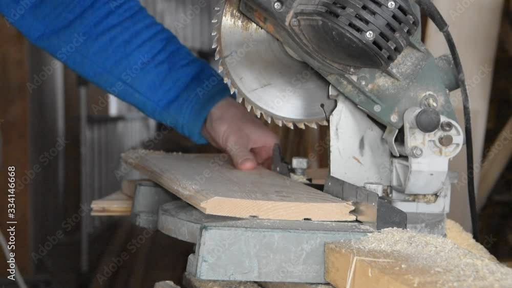 machine tool circular saw miter cutting sawing Board man. machine tool circular saw miter cutting sawing Board man.