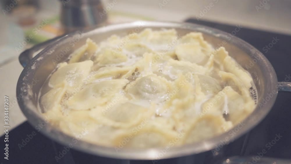 ravioli cooked in boiling water in a home kitchen, italy, slow motion ravioli cooked in boiling water in a home kitchen, italy, slow motion