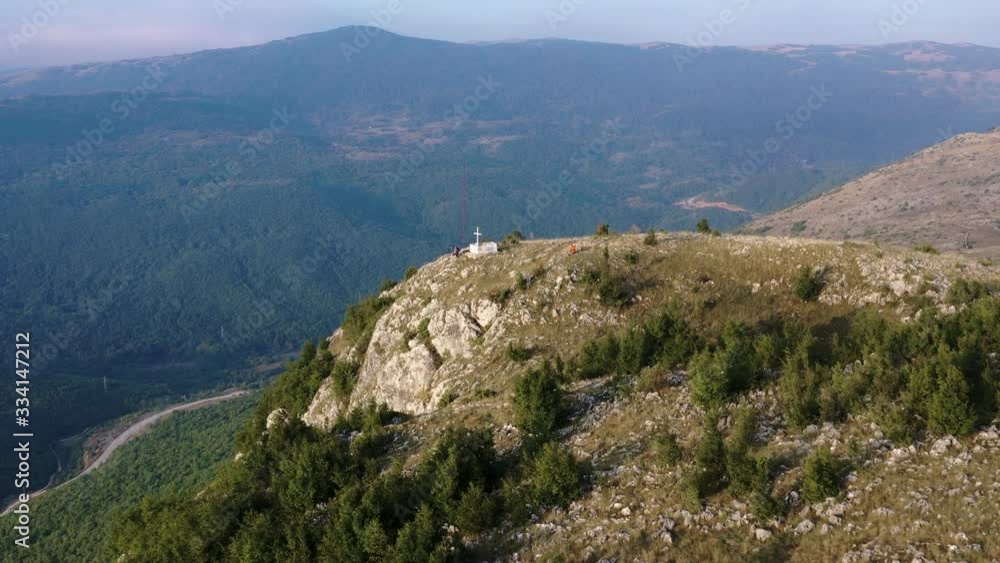 Aerial Over Krizevac Cross Mountain In Bosnia And Herzegovina With Forested Hills In The Background Aerial Over Krizevac Cross Mountain In Bosnia And Herzegovina With Forested Hills In The Background