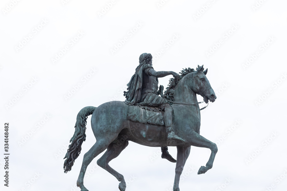 Statue of Louis XIV in white sky background taken in  summer day