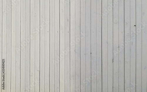 Background of vertical wooden boards in light beige color
