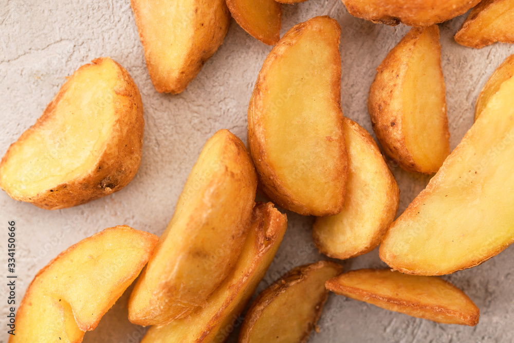 potatoes fried in oil on a gray background potatoes fried in oil on a gray background