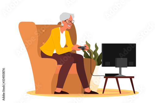 Old woman playing video games. Senior playing video games