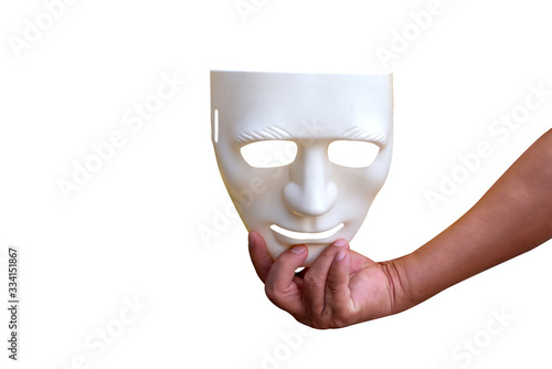 Back Hand holding white mask isolated on white background. Anonymous social masking concept.