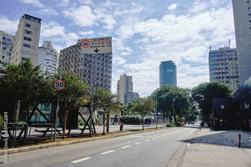 Cidade Jardim Avenue during coronavirus outbreak, Sao Paulo, Brazil with some cyclists. March 2020