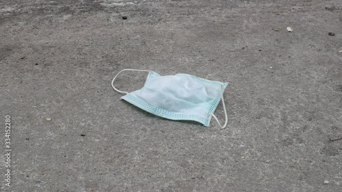 used mask on the floor concept corona virus,covid-19