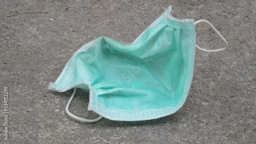 used mask on the floor concept corona virus,covid-19