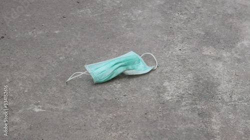 used mask on the floor concept corona virus,covid-19