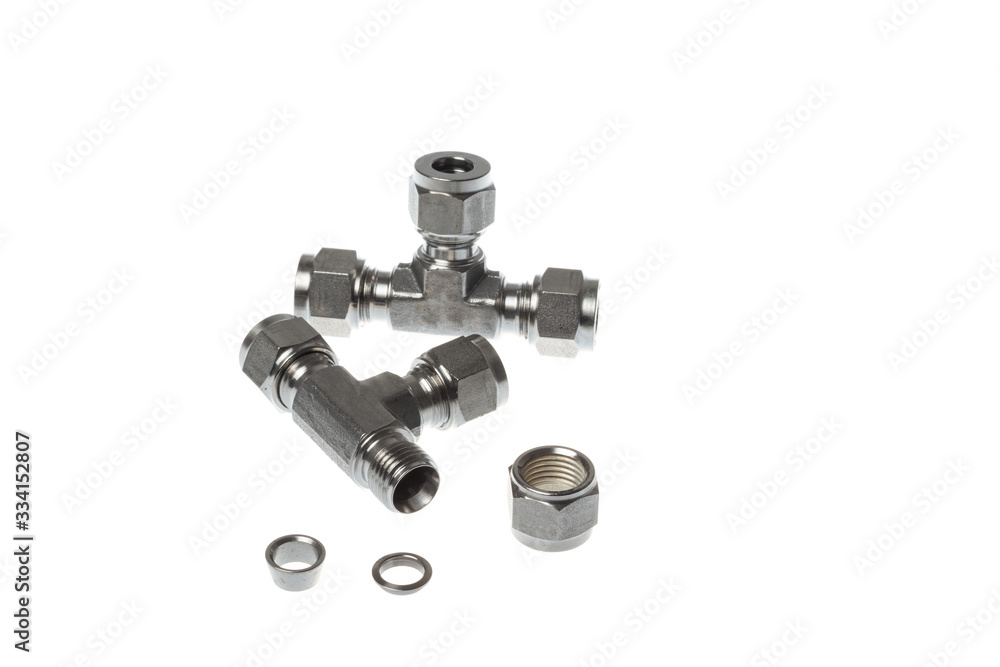 Set of stainless steel 3 way couplings one of which is disassembled, isolated on white background Set of stainless steel 3 way couplings one of which is disassembled, isolated on white background