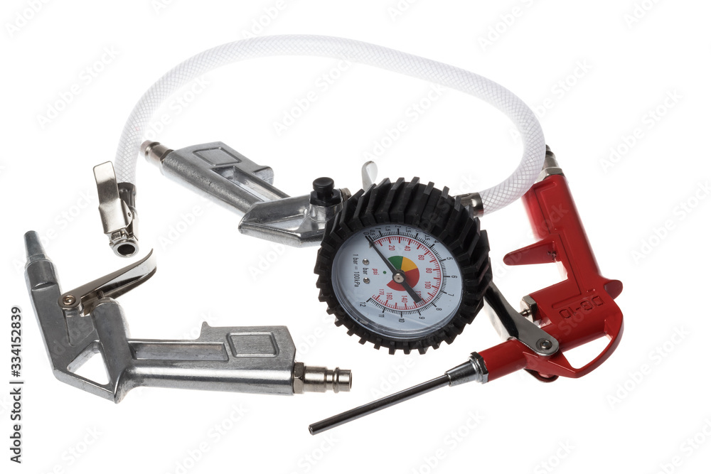 Compressed air brush hand guns one of which has a manometer and hose, isolated on white background Compressed air brush hand guns one of which has a manometer and hose, isolated on white background