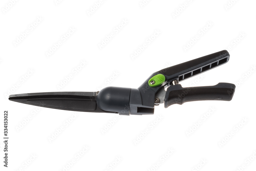 Closed black grass shears with angle rotation and spring mechanism, isolated on white background Closed black grass shears with angle rotation and spring mechanism, isolated on white background
