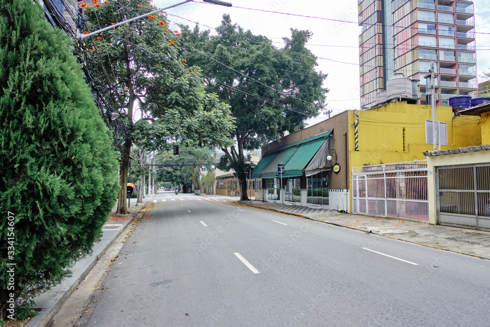 Empty street in Vila Olimpia, during coronavirus outbreak, Sao Paulo, Brazil with some cyclists - March 2020 Empty street in Vila Olimpia, during coronavirus outbreak, Sao Paulo, Brazil with some cyclists - March 2020