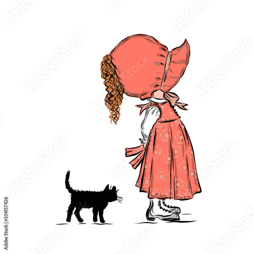 Little girl in cap stands with black cat. 