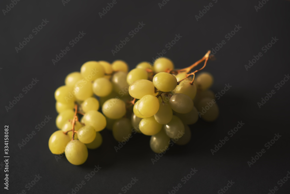 Bunch of grapes close up over black background Bunch of grapes close up over black background