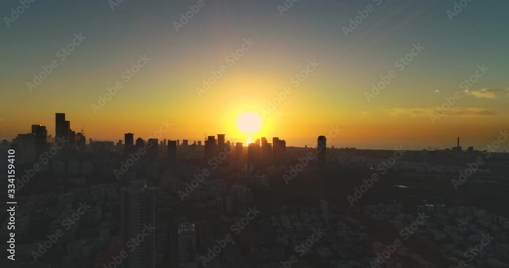 Aerial view above Tel Aviv at sunset, city in the middle east at Israel. Skyline view of modern town landscape with business district, high buildings real estate Aerial view above Tel Aviv at sunset, city in the middle east at Israel. Skyline view of modern town landscape with business district, high buildings real estate