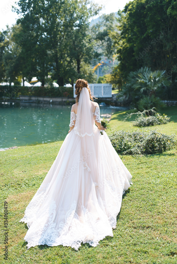 bride walking away along lake