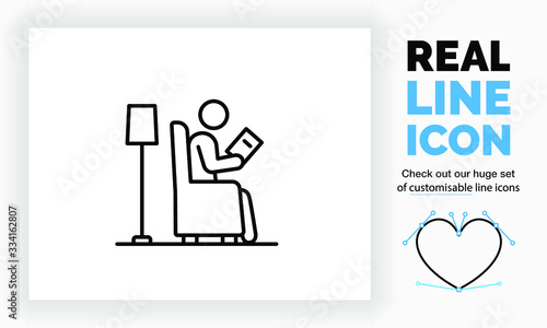 Editable real line icon of a stick figure reading a book in his chair at home in the living room with a lamp behind him as reading light in modern black lines on a clean white background as eps vector