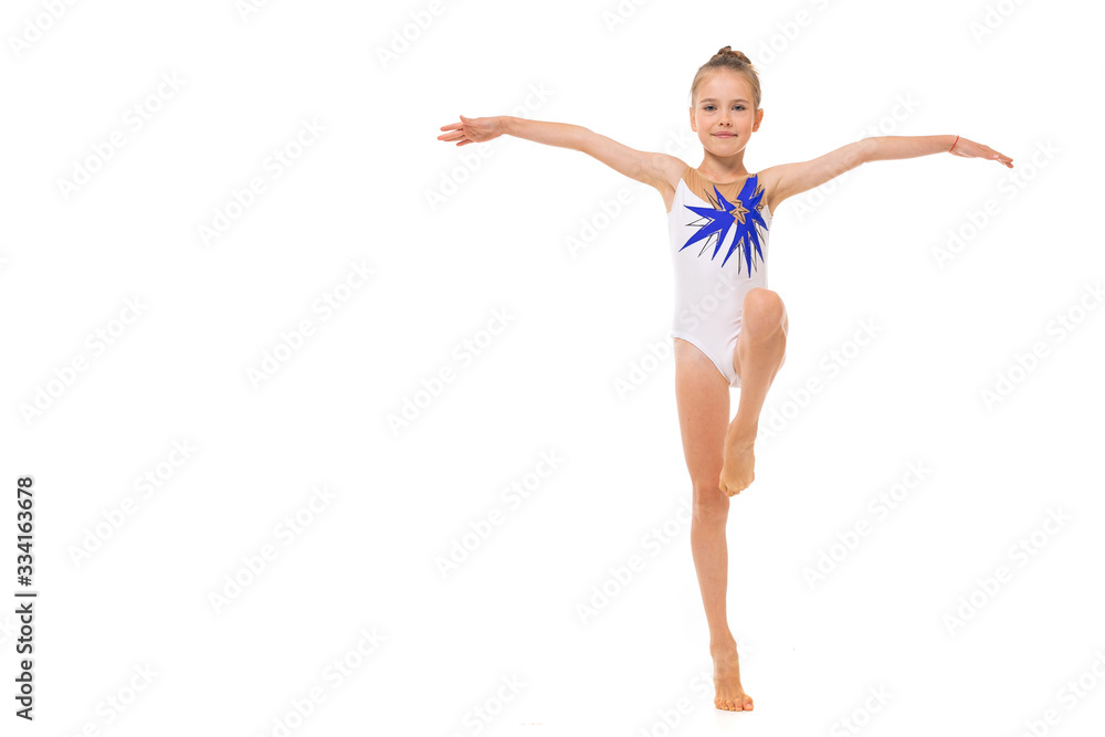 girl doing gymnastics in a sports swimsuit on a white background with copy space girl doing gymnastics in a sports swimsuit on a white background with copy space
