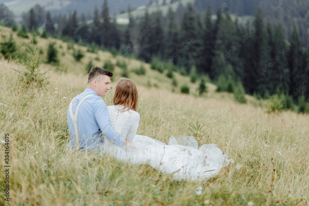 Photoshoot of the bride and groom in the mountains. Boho style wedding photo. Photoshoot of the bride and groom in the mountains. Boho style wedding photo.