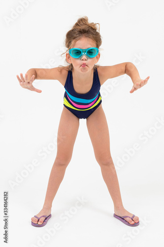 girl in a swimsuit with glasses for diving under the water on a white background