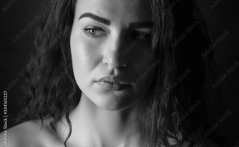 Black and white portrait of a beautiful young woman. Black and white portrait of a beautiful young woman.
