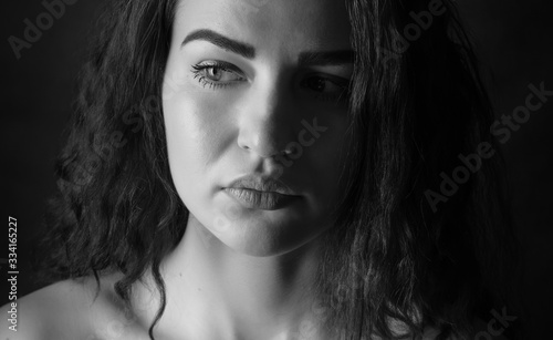 Black and white portrait of a beautiful young woman.