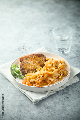 Pork cutlet with sauerkraut stew photo