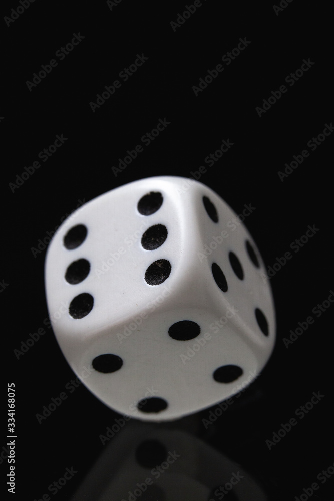 White dice on the black background. White dice on the black background.