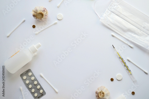 treatment of coronavirus colds. temperature thermometer and drugs for treating infections. Pills, bandage, chlorhexidine photo