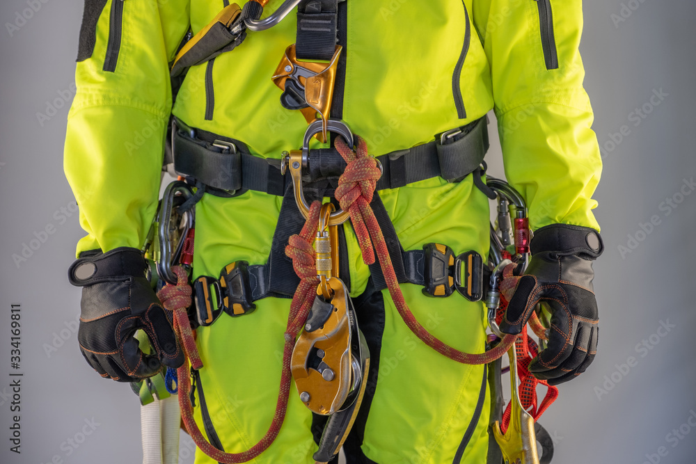 Man in personal protective equipment against falling from a height Man in personal protective equipment against falling from a height