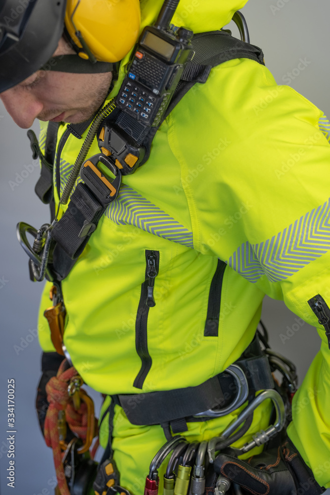 Man in personal protective equipment against falling from a height Man in personal protective equipment against falling from a height