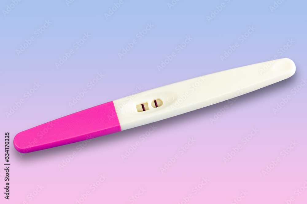 Pregnancy test isolated on gradient background from blue to pink Pregnancy test isolated on gradient background from blue to pink